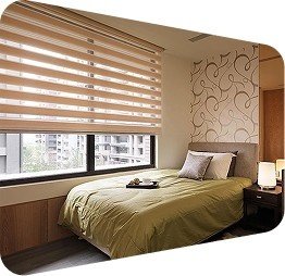 Zebra-blinds-in beigetan-on-bedroom-windows-with decorative-wall-panel and-olive-bedding